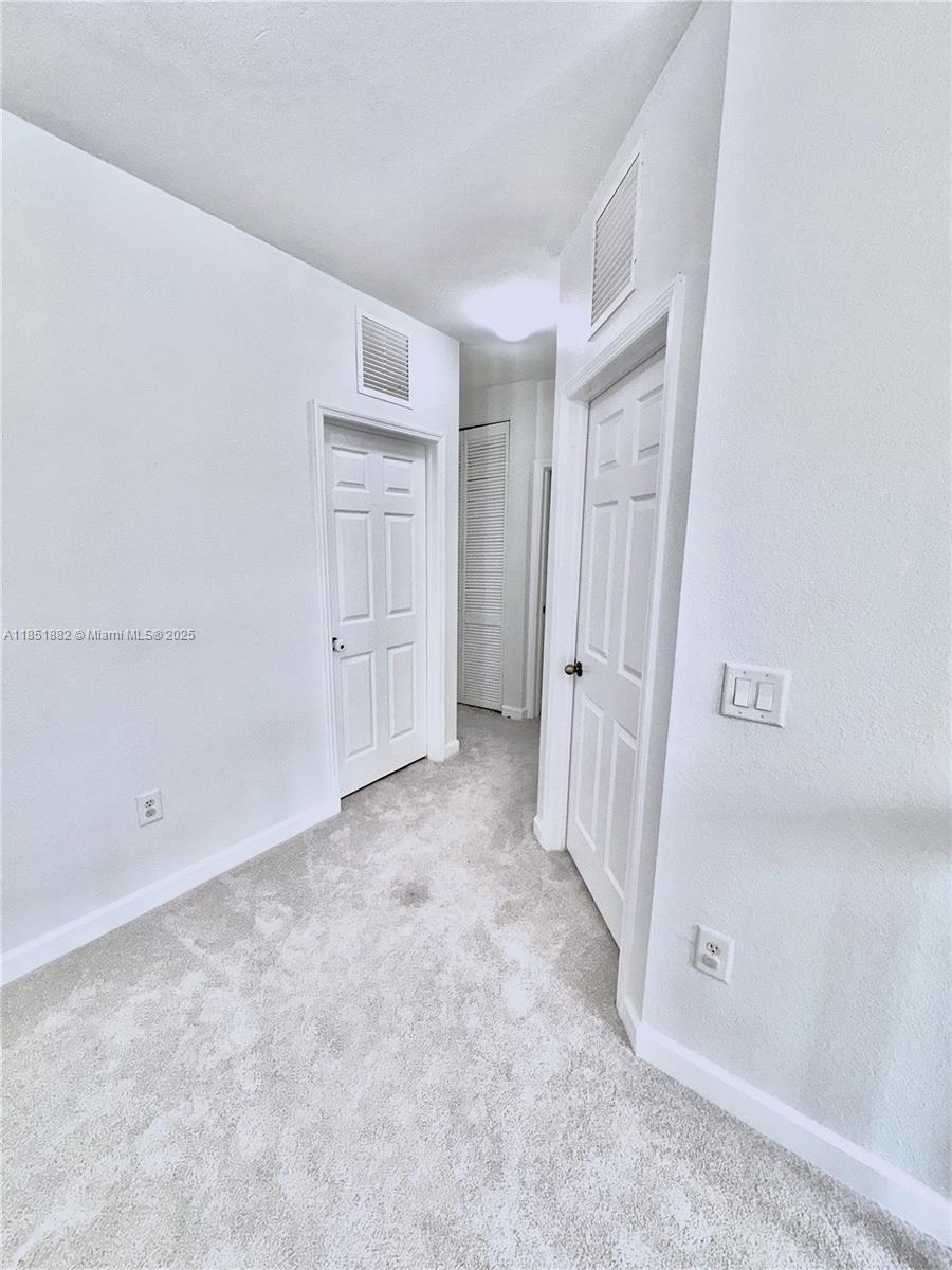 2933 Southeast 2nd Drive, Unit 2 Homestead, FL 33033 - Photo 29 of 38 wooden floor in an empty room