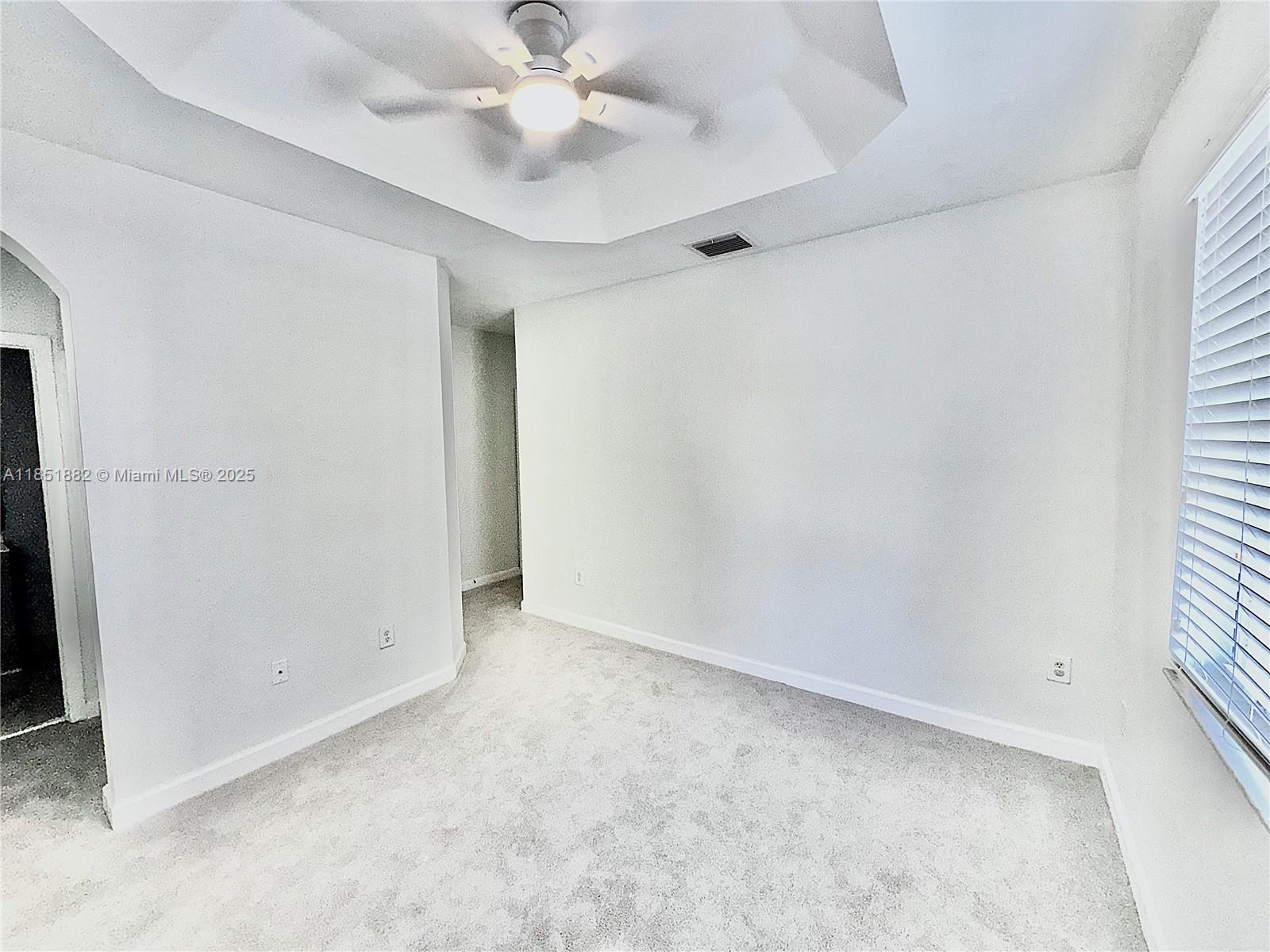 2933 Southeast 2nd Drive, Unit 2 Homestead, FL 33033 - Photo 36 of 38 an empty room with a window and a fan