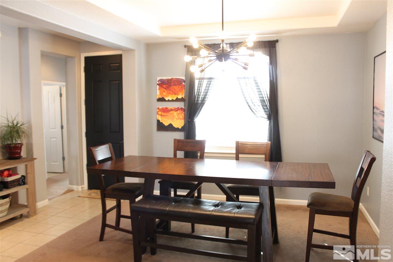 2495 Spring Flower Drive Reno, NV 89521 - Photo 14 of 30 a view of a dining room with a table and chairs