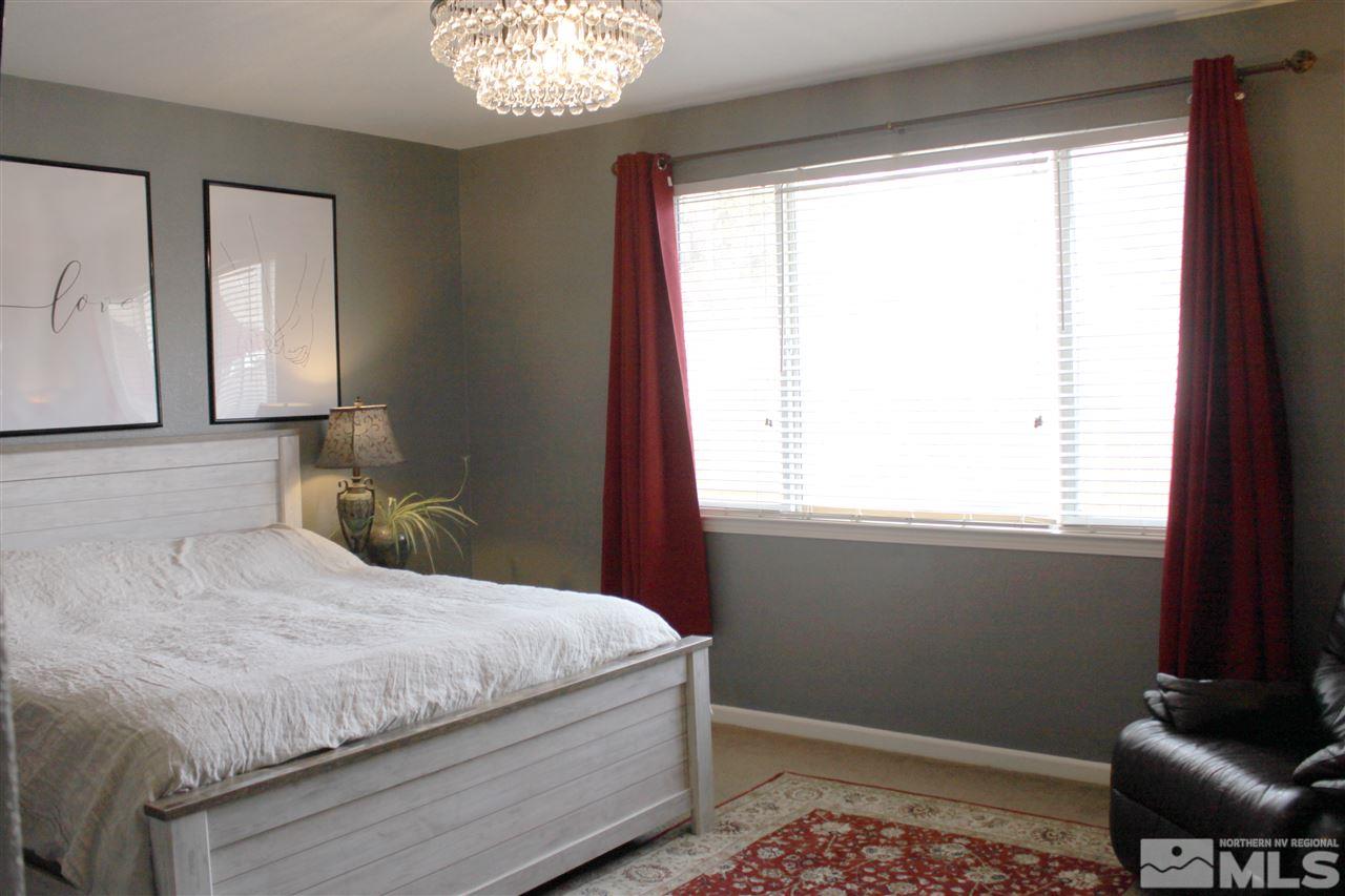 2495 Spring Flower Drive Reno, NV 89521 - Photo 15 of 30 a bedroom with a bed and a window