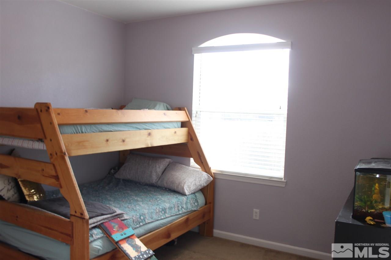 2495 Spring Flower Drive Reno, NV 89521 - Photo 20 of 30 a bedroom with a bed and a window