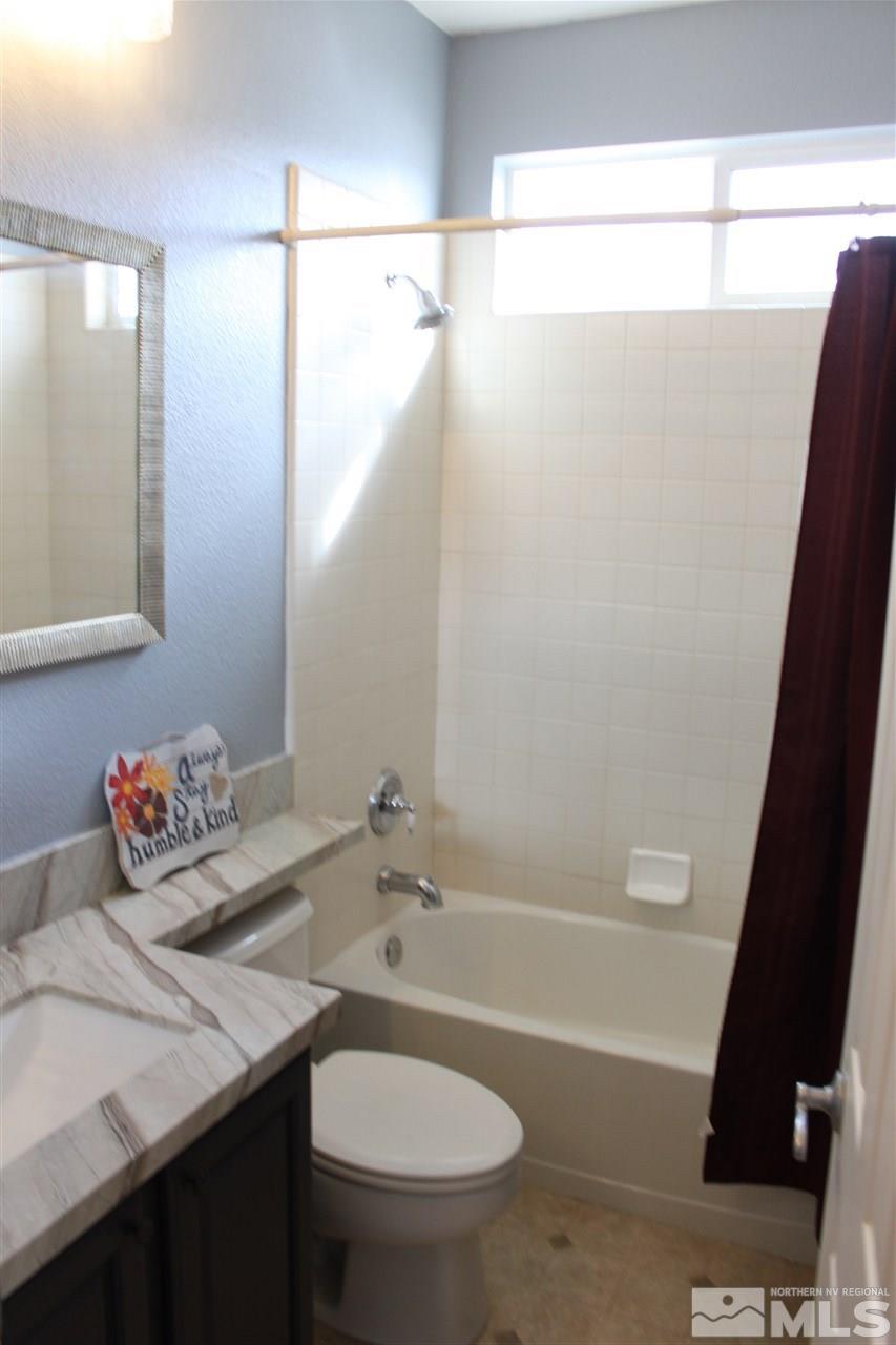 2495 Spring Flower Drive Reno, NV 89521 - Photo 22 of 30 a bathroom with a sink and a mirror