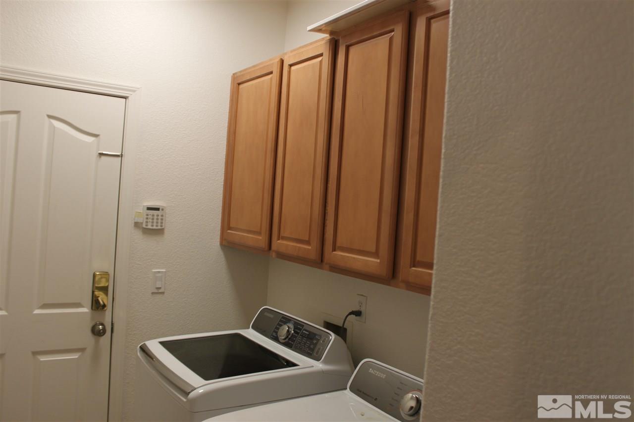 2495 Spring Flower Drive Reno, NV 89521 - Photo 23 of 30 a bathroom with a sink and glass door