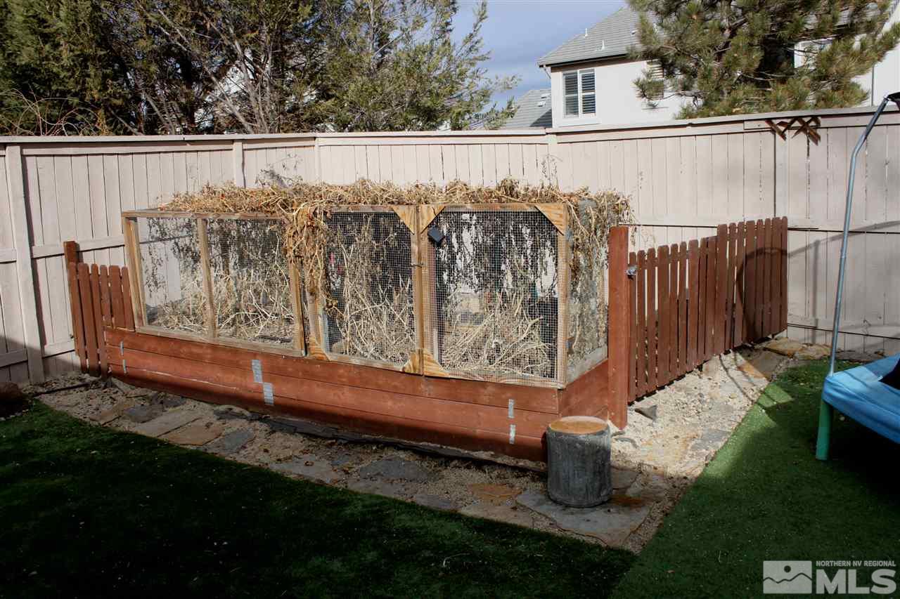 2495 Spring Flower Drive Reno, NV 89521 - Photo 26 of 30 a wooden fence with some trees in the background