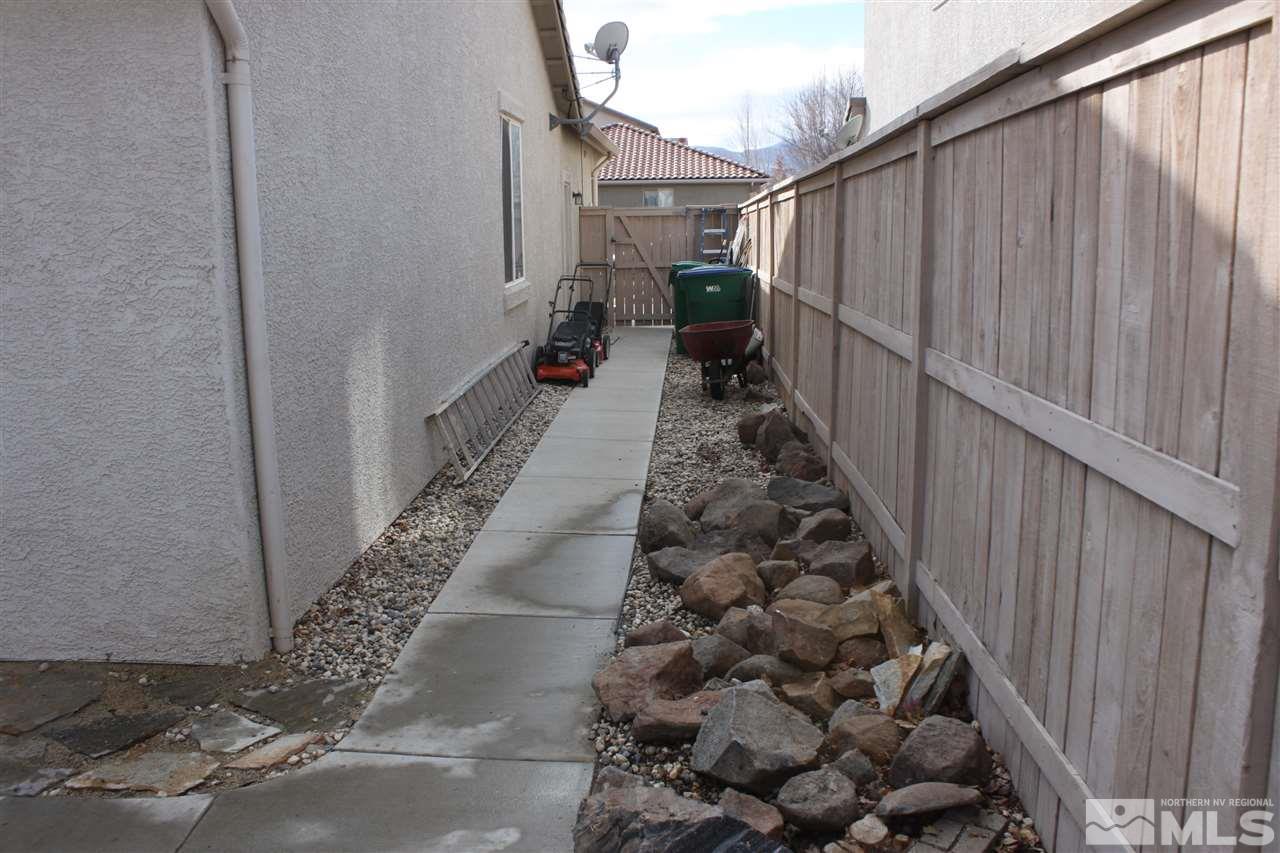 2495 Spring Flower Drive Reno, NV 89521 - Photo 28 of 30 a view of a pathway of a house with wooden fence