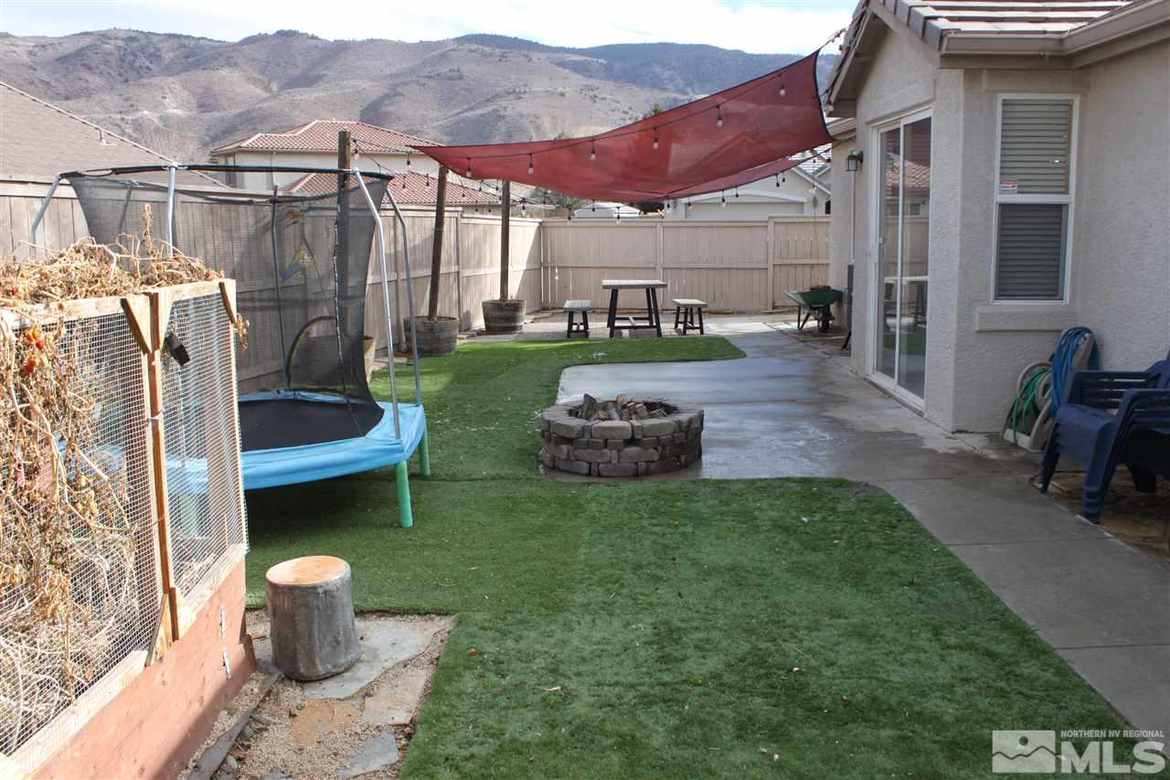 2495 Spring Flower Drive Reno, NV 89521 - Photo 3 of 30 a view of a patio with chairs and a yard