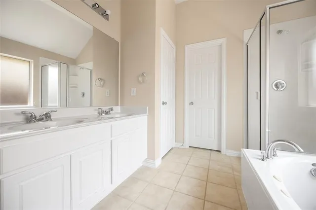 a bathroom with a double vanity sink mirror and double
