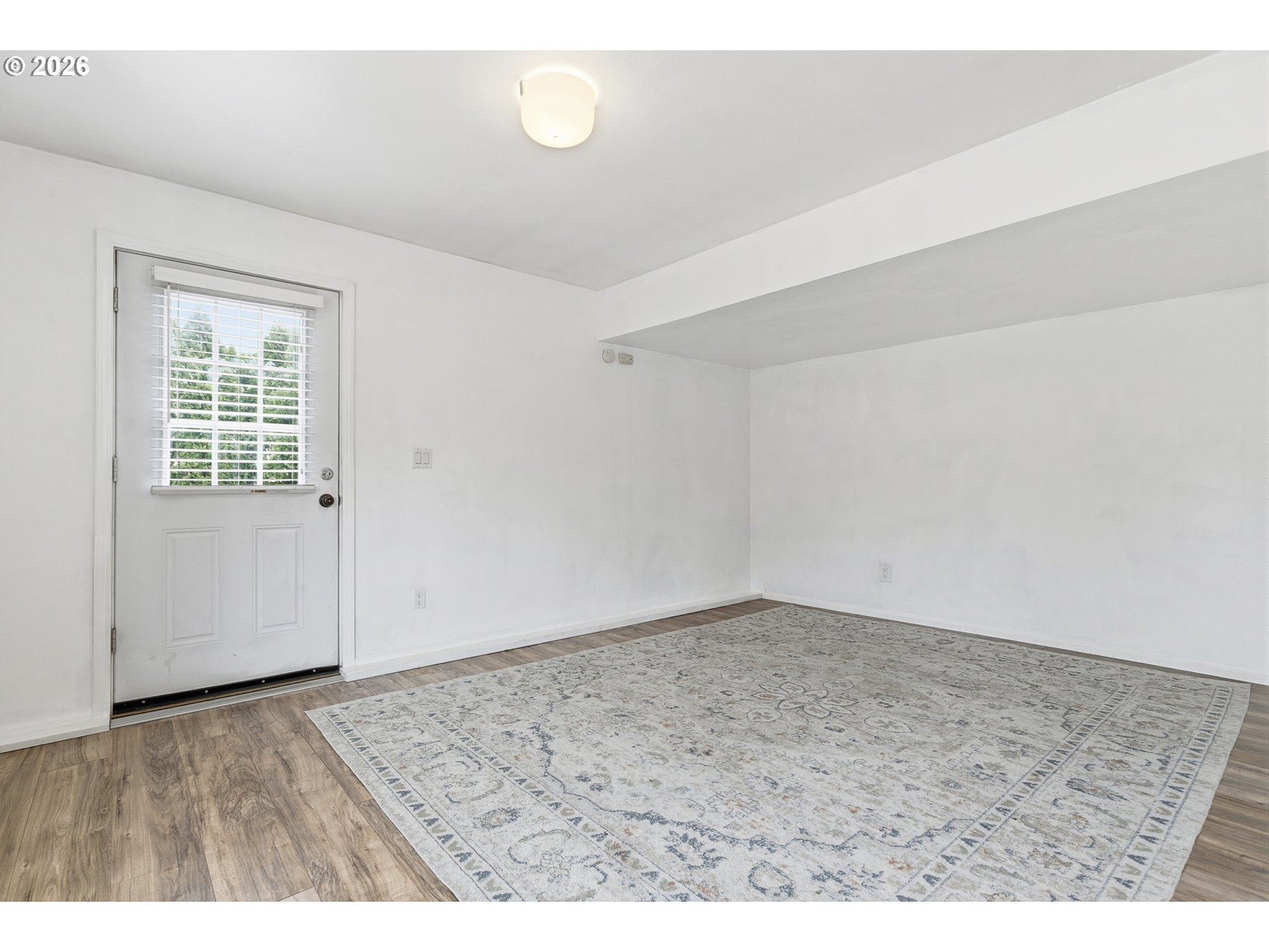 2160 Southwest 26th Street Gresham, OR 97080 - Photo 34 of 48 an empty room with wooden floor and windows