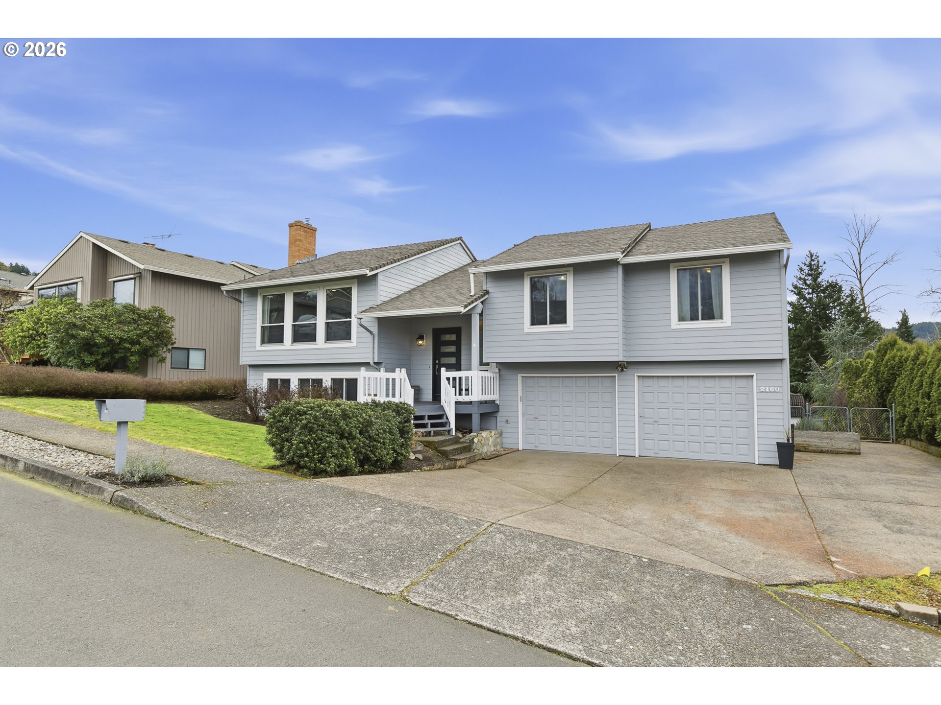 2160 Southwest 26th Street Gresham, OR 97080 - Photo 46 of 48 a front view of a house with a yard and garage