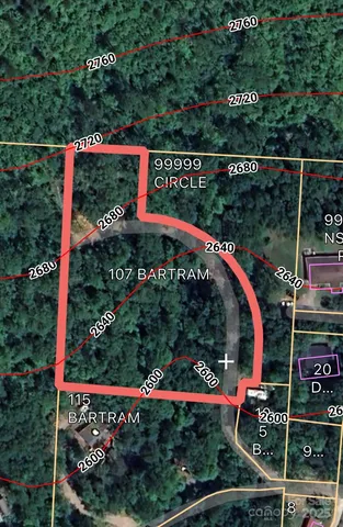 a view of a houses with mountains in the background