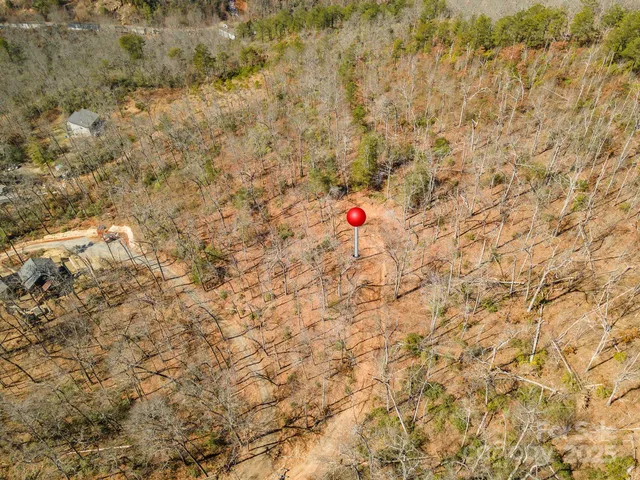 a view of a houses with a trees in the background