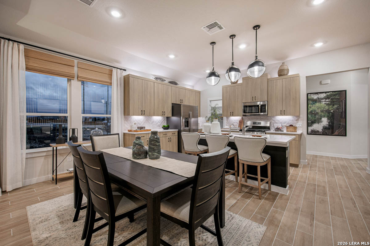 146 Stream Street Seguin, TX 78155 - Photo 14 of 27 a large kitchen with a table and chairs