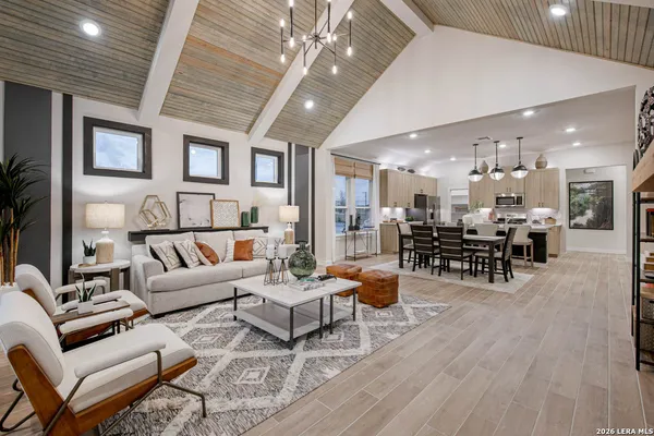 a living room with furniture and a table