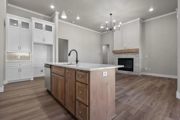 a kitchen with stainless steel appliances a refrigerator sink and stove