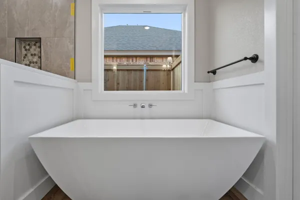 a bathroom with a bathtub and shower