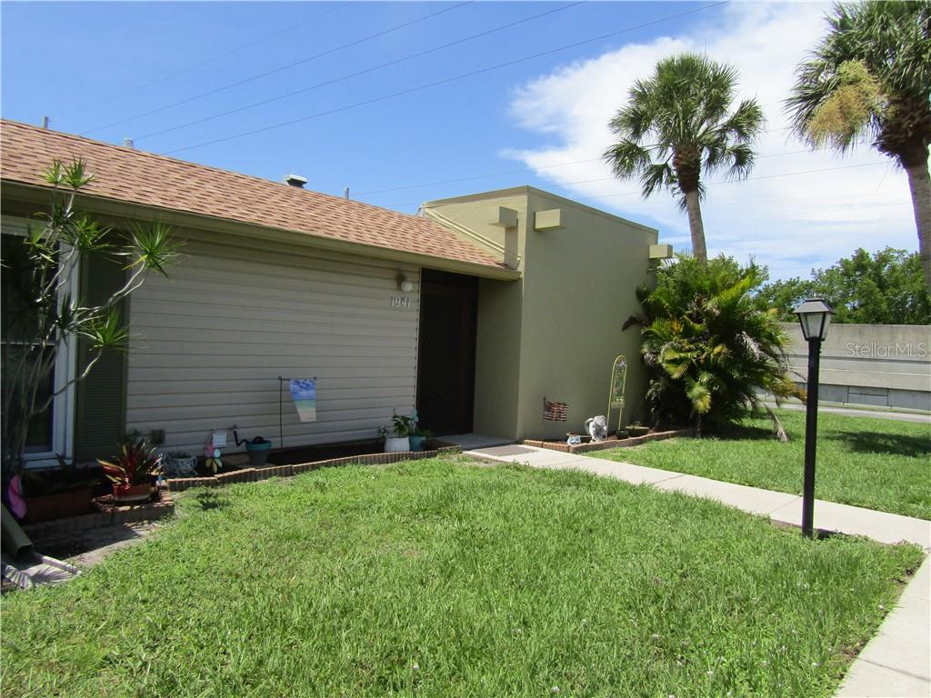1941 Settlement Road, Unit 11 Venice, FL 34285 - Photo 1 of 1 a front view of a house with garden