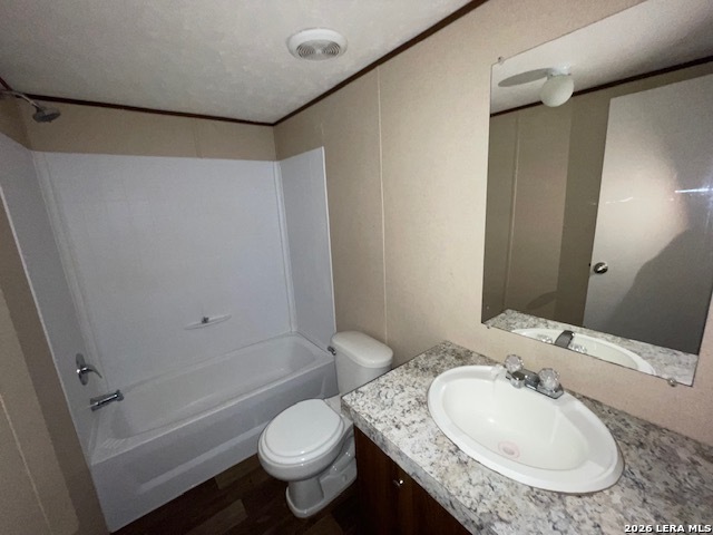207 Hopi Trail Bandera, TX 78003 - Photo 12 of 21 a bathroom with a granite countertop sink toilet and shower
