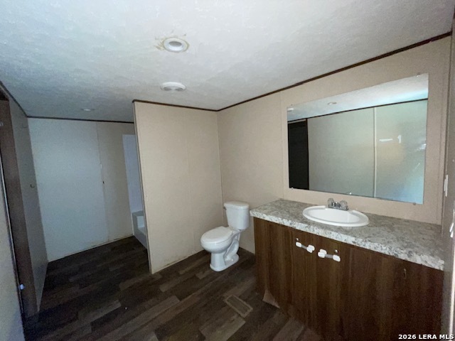 207 Hopi Trail Bandera, TX 78003 - Photo 14 of 21 a bathroom with a granite countertop sink and a mirror