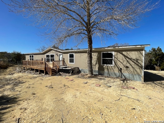 207 Hopi Trail Bandera, TX 78003 - Photo 2 of 21 a view of house with yard and sitting area