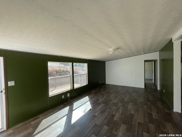 207 Hopi Trail Bandera, TX 78003 - Photo 3 of 21 an empty room with wooden floor and windows