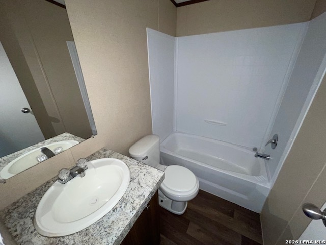 207 Hopi Trail Bandera, TX 78003 - Photo 8 of 21 a bathroom with a granite countertop toilet and a bathtub