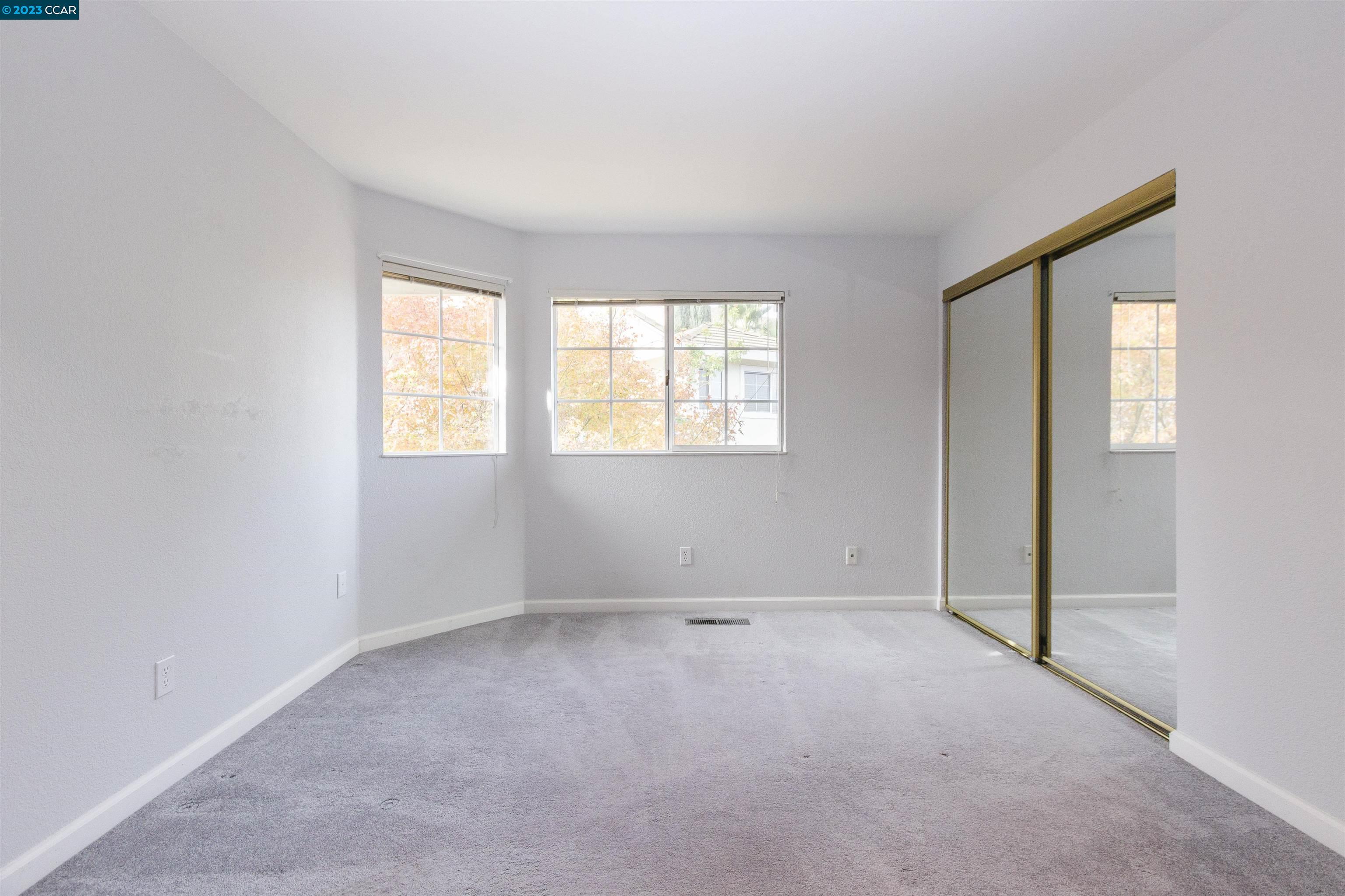 5291 Pebble Glen Drive Concord, CA 94521 - Photo 11 of 21 an empty room with windows