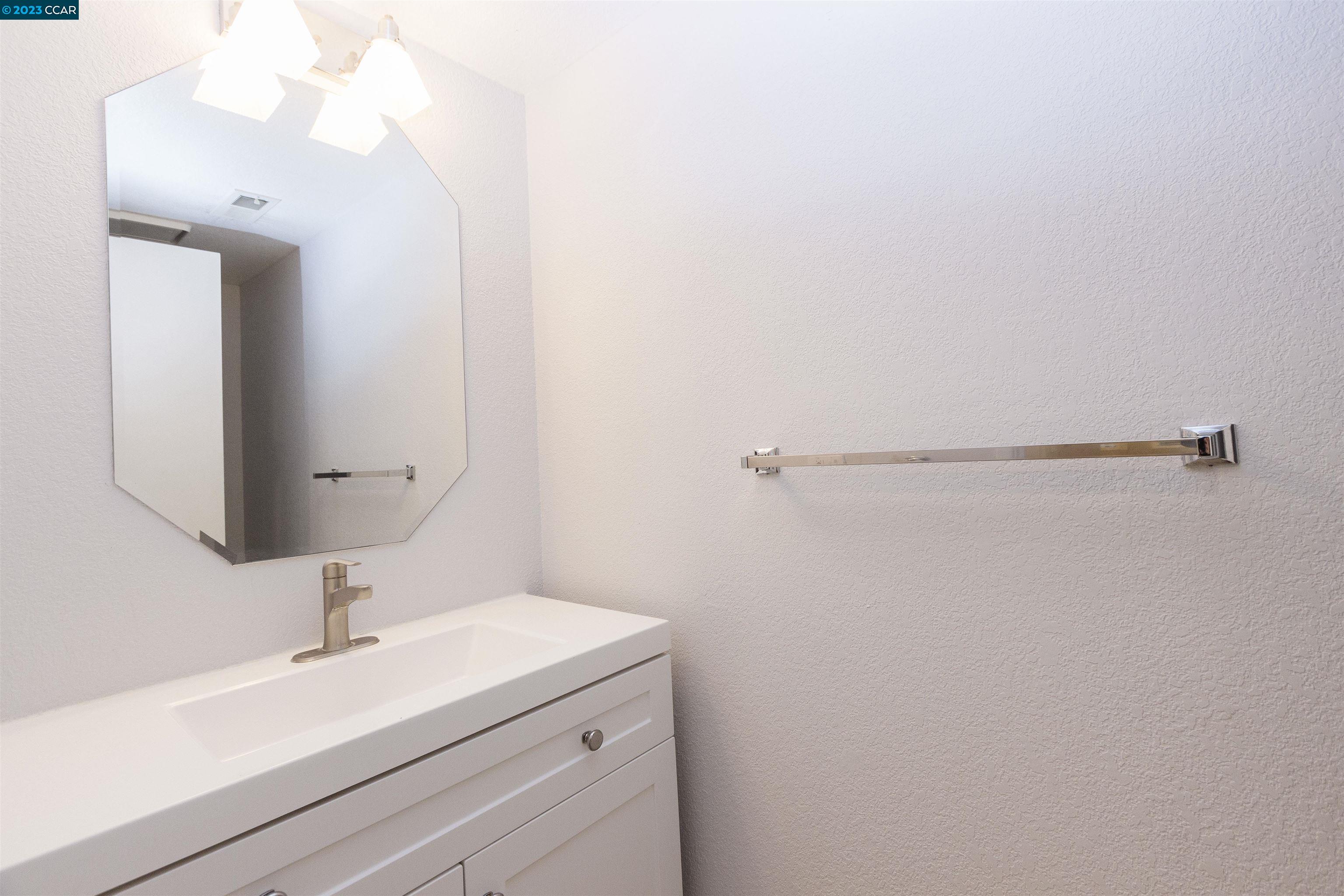 5291 Pebble Glen Drive Concord, CA 94521 - Photo 12 of 21 a bathroom with a sink and a mirror