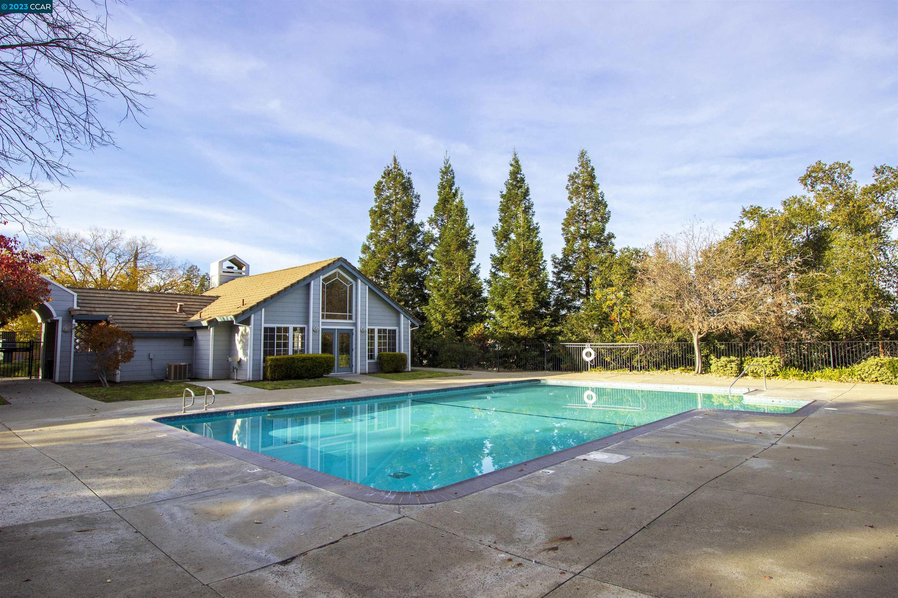 5291 Pebble Glen Drive Concord, CA 94521 - Photo 20 of 21 a front view of a house with a yard and trees
