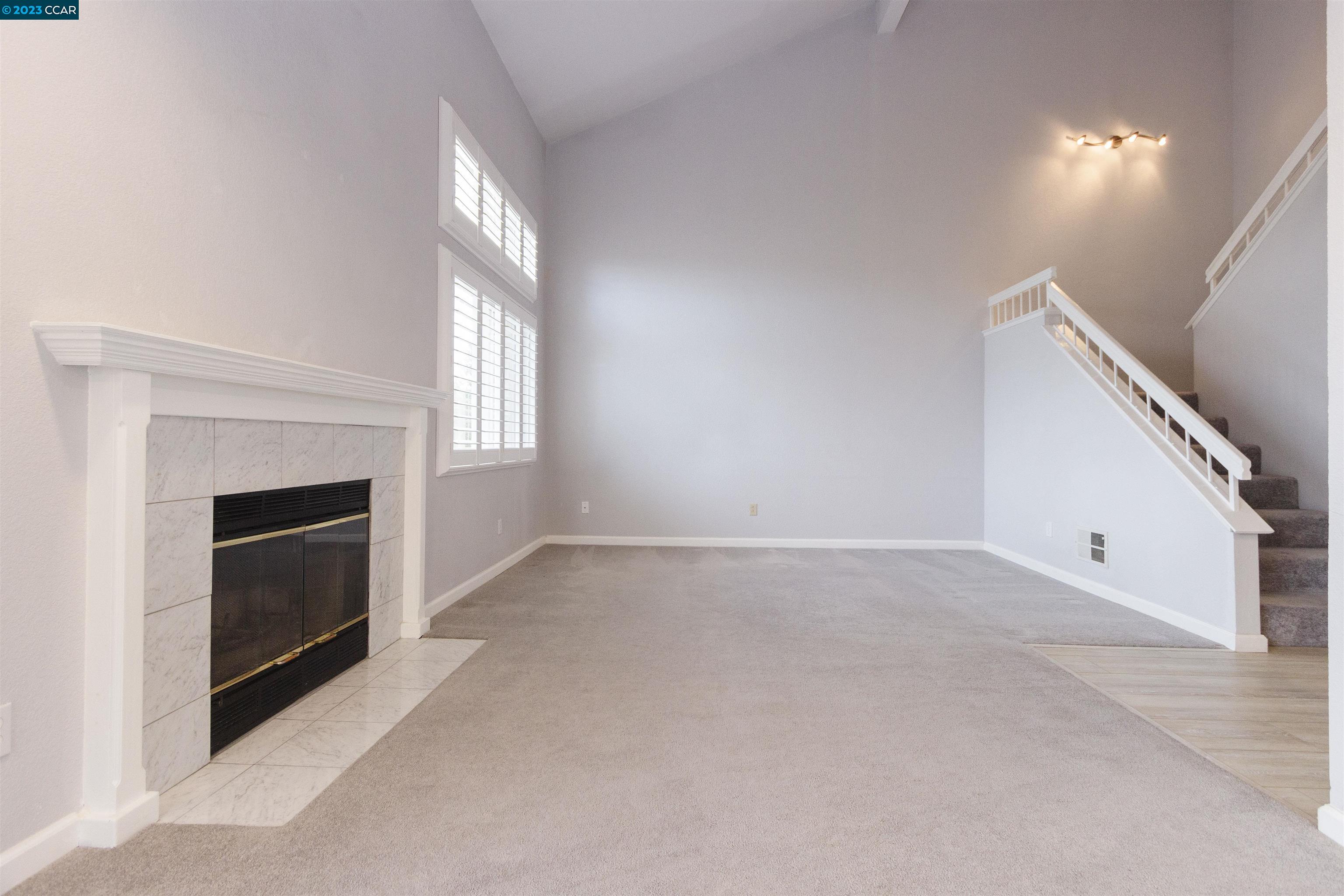 5291 Pebble Glen Drive Concord, CA 94521 - Photo 5 of 21 a view of empty room with fireplace and window