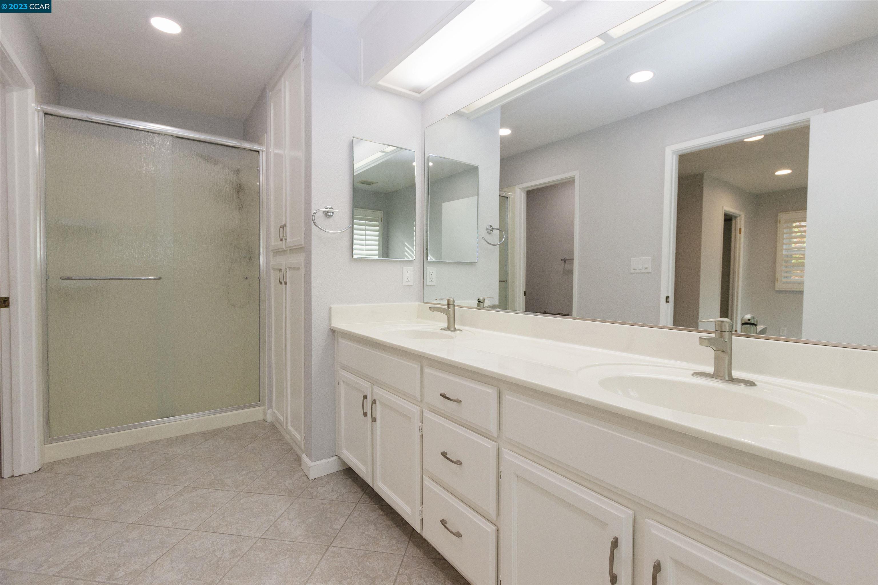 5291 Pebble Glen Drive Concord, CA 94521 - Photo 9 of 21 a bathroom with double sink and a mirror