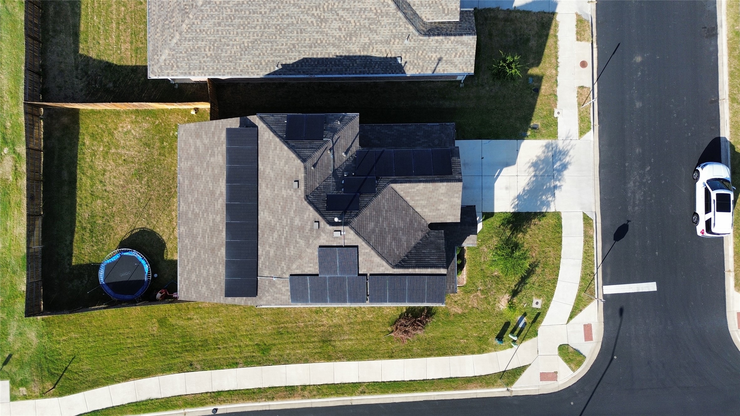 201 Finley Rae Drive Georgetown, TX 78626 - Photo 3 of 17 An aerial perspective reveals solar panels adorning the rooftop of a charming residence.