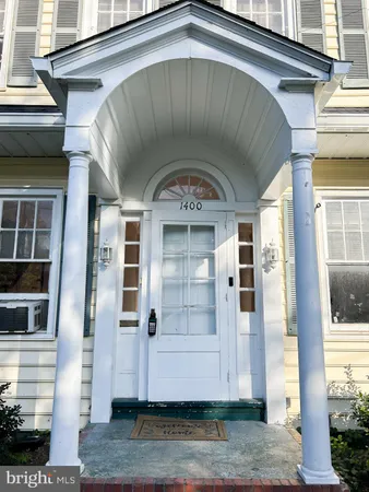 a front view of a house with a glass door
