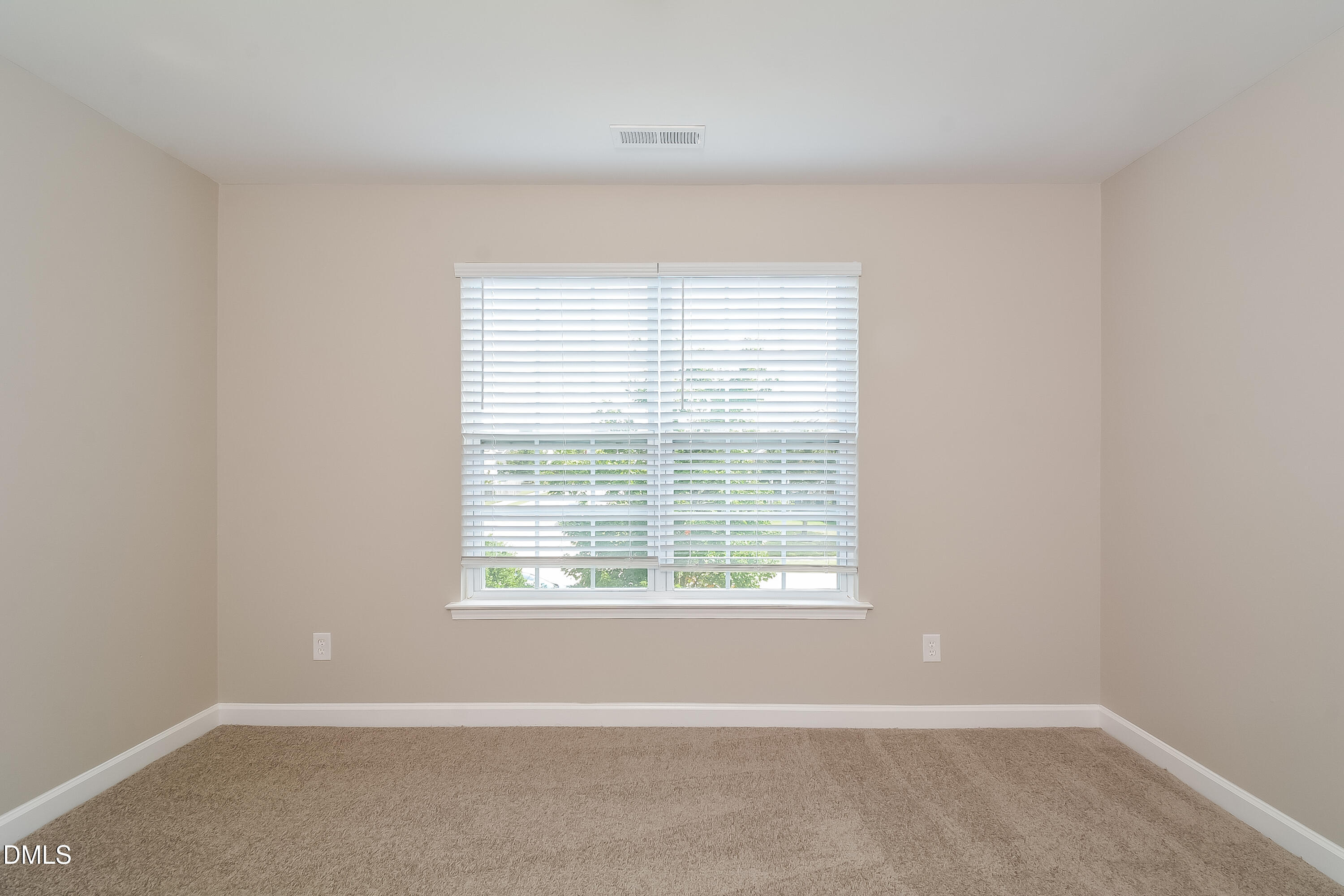 2231 Lazy River Drive Raleigh, NC 27610 - Photo 13 of 17 an empty room with a window
