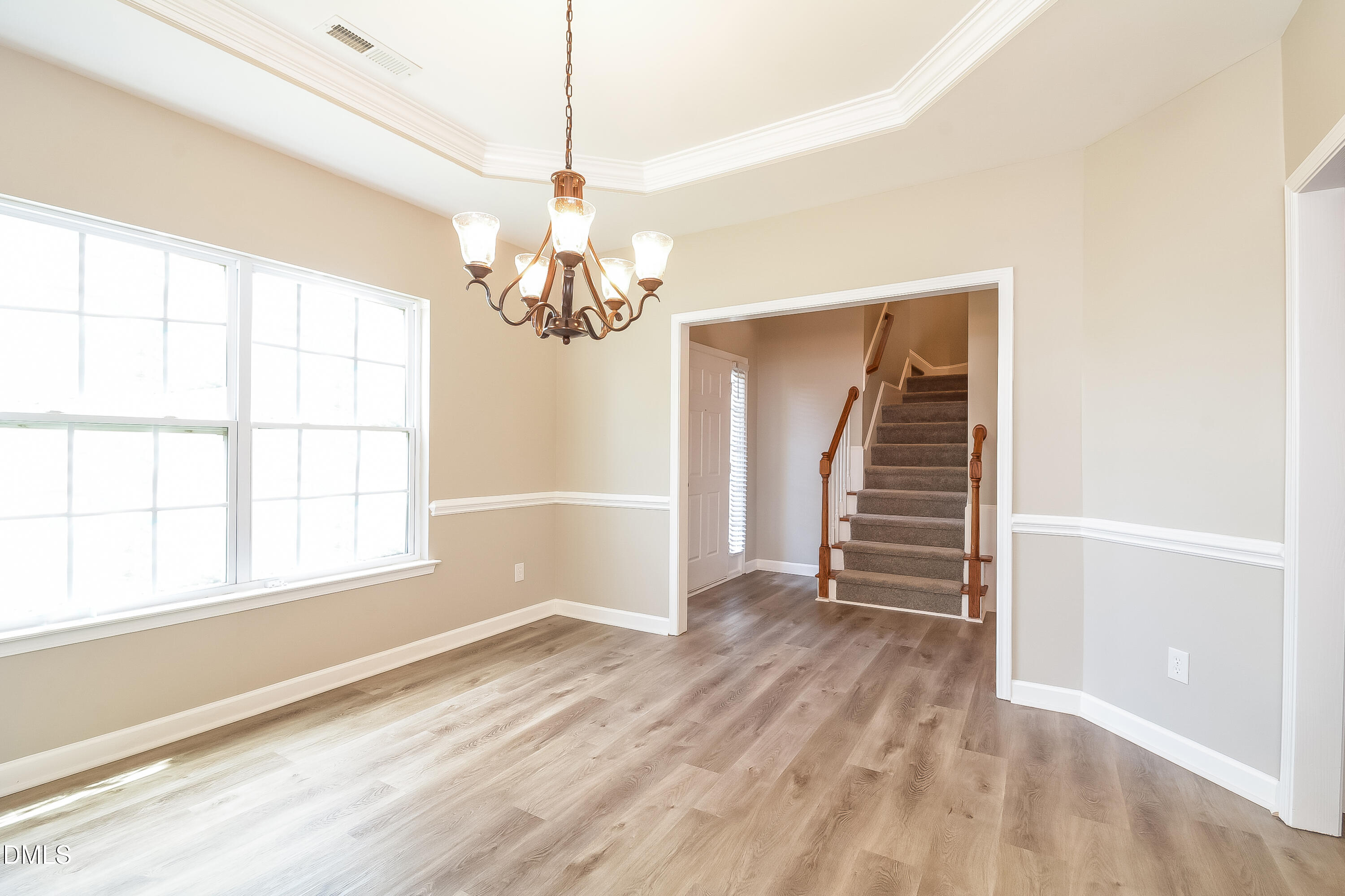 2231 Lazy River Drive Raleigh, NC 27610 - Photo 3 of 17 a view of wooden floor and windows in a room