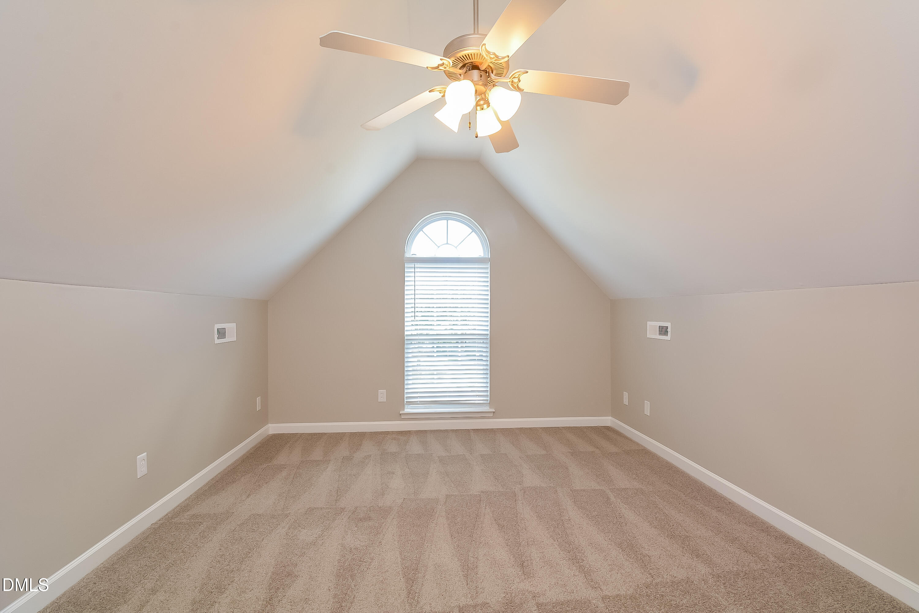 2231 Lazy River Drive Raleigh, NC 27610 - Photo 7 of 17 an empty room with a chandelier fan and windows