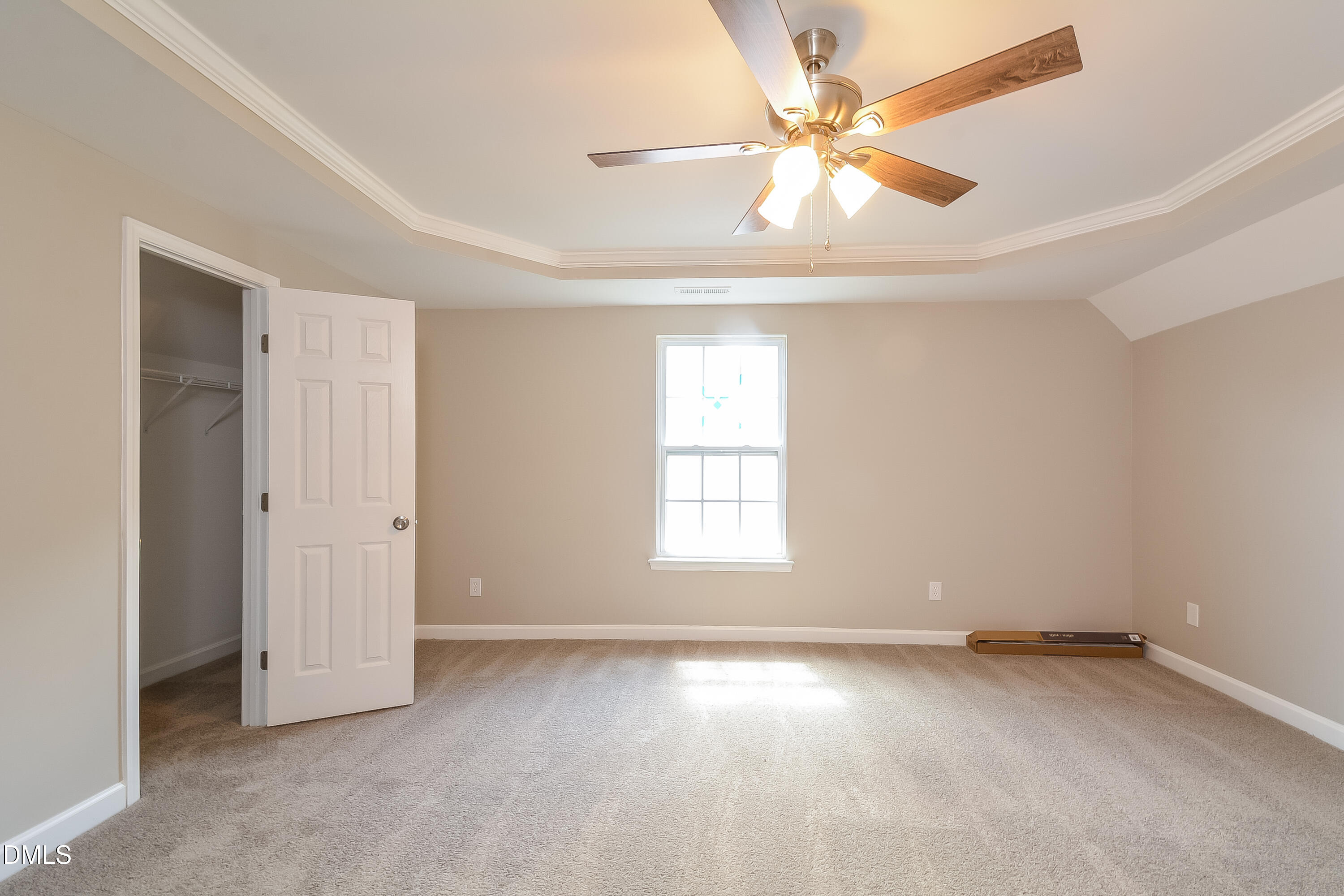 2231 Lazy River Drive Raleigh, NC 27610 - Photo 9 of 17 an empty room with windows and fan