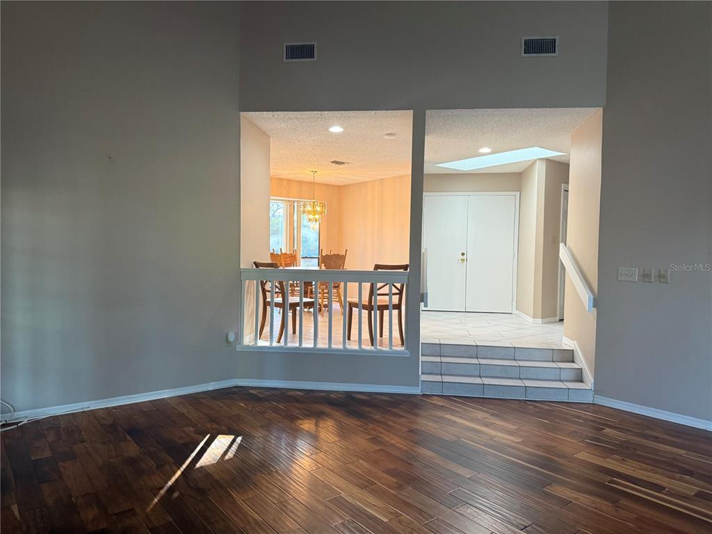 11711 Ridgeview Lane Seminole, FL 33772 - Photo 9 of 30 a view of wooden floor and windows in a room