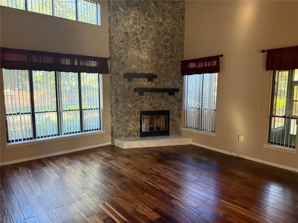 11711 Ridgeview Lane Seminole, FL 33772 - Photo 10 of 30 a view of an empty room with wooden floor and a window