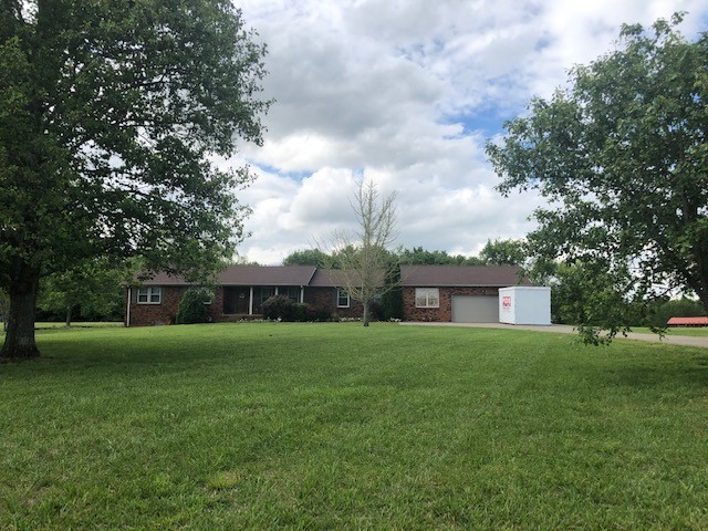 3270 Ott Wilson Road Springfield, TN 37172 - Photo 2 of 7 a view of a house next to a big yard and large trees
