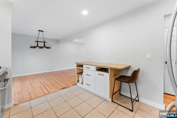 a room with a chair and white walls