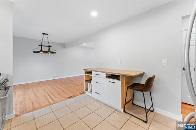 a room with a chair and white walls