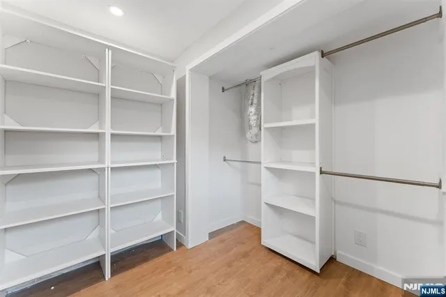 a view of an empty walk in closet
