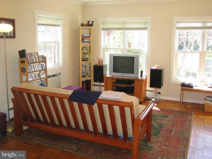 a living room with furniture fireplace and a flat screen tv