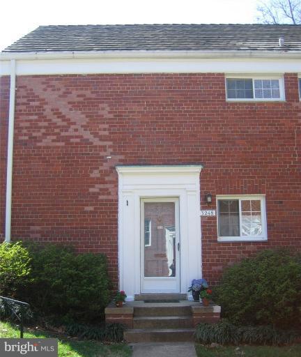 3248 Gunston Road, Unit 724 Alexandria, VA 22302 - Photo 11 of 19 a front view of a house with a yard