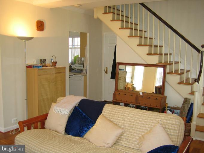 3248 Gunston Road, Unit 724 Alexandria, VA 22302 - Photo 12 of 19 a bedroom with a bed and a chandelier