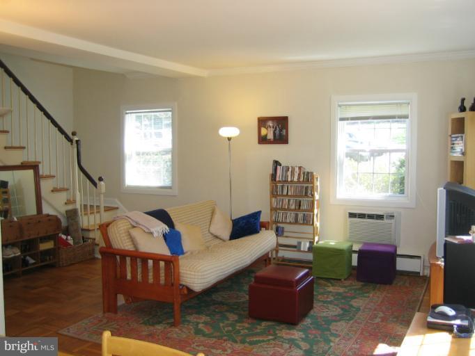 3248 Gunston Road, Unit 724 Alexandria, VA 22302 - Photo 16 of 19 a living room with furniture and a window