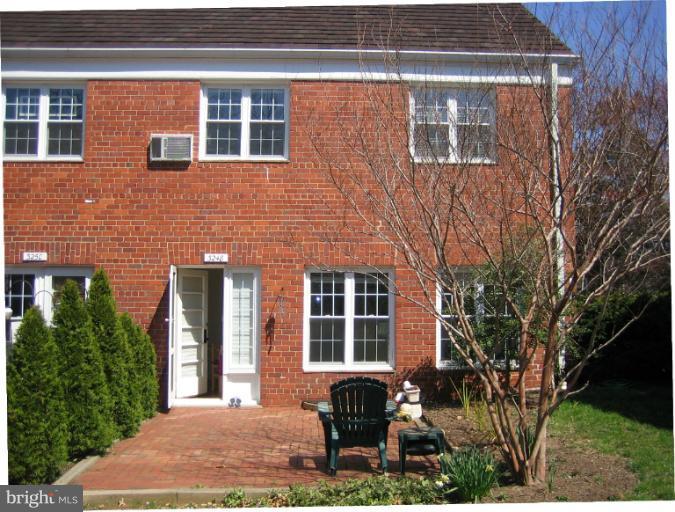 3248 Gunston Road, Unit 724 Alexandria, VA 22302 - Photo 17 of 19 a front view of a house with garden