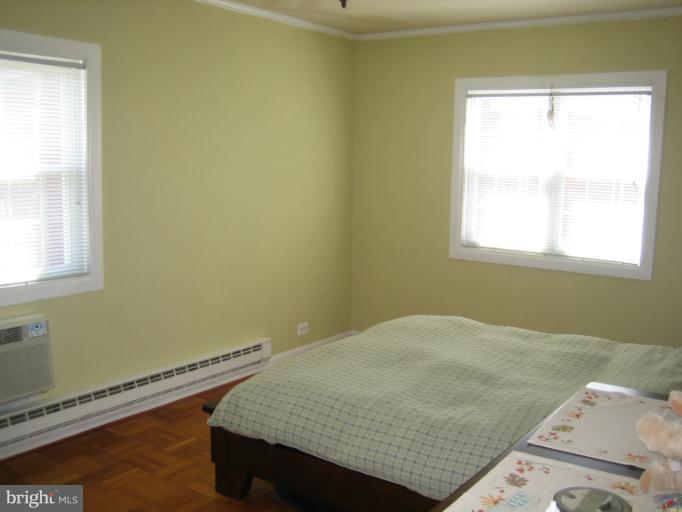 3248 Gunston Road, Unit 724 Alexandria, VA 22302 - Photo 18 of 19 a bedroom with a bed and a window