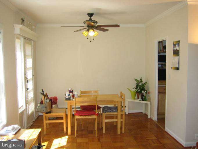 3248 Gunston Road, Unit 724 Alexandria, VA 22302 - Photo 7 of 19 a dining room with furniture and a window
