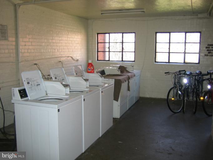 3248 Gunston Road, Unit 724 Alexandria, VA 22302 - Photo 10 of 19 a utility room with multiple dryer and washer